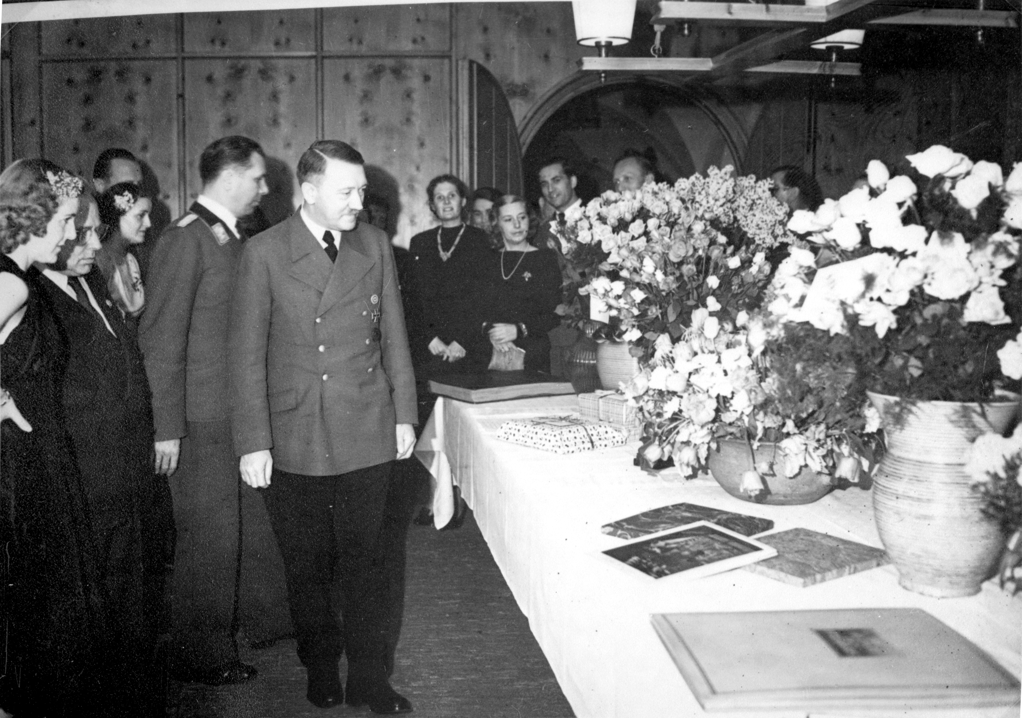 Adolf Hitler and Eva Braun look at the gifts on the occasion of the 54th birthday of the Führer, from Eva Braun's albums